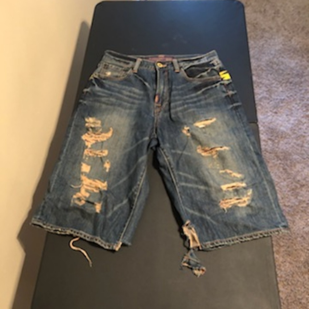 Christian Audigier cut up jeans